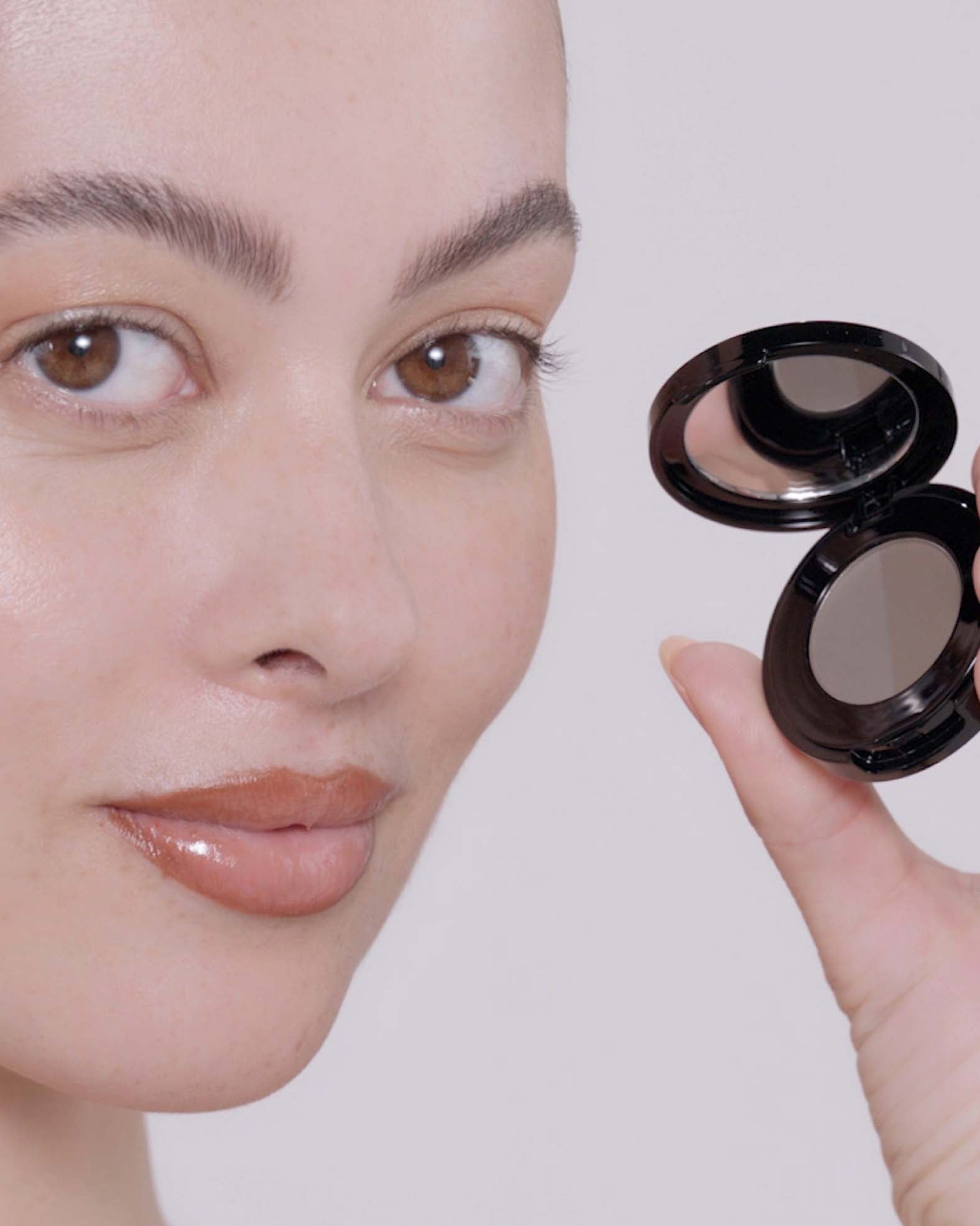 Applying Brow Powder Duo in Ash Brown