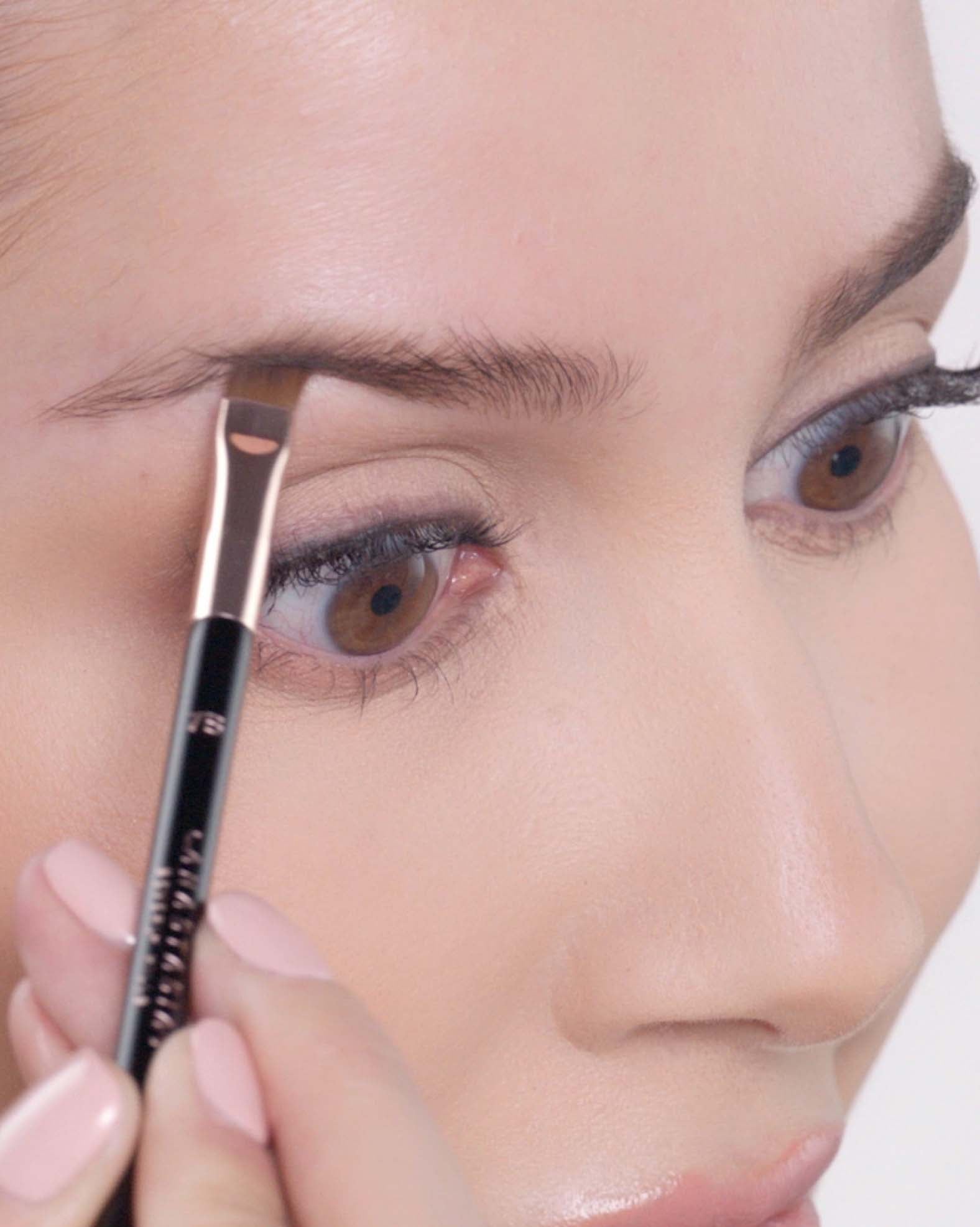 Applying Brow Powder Duo in Soft Brown