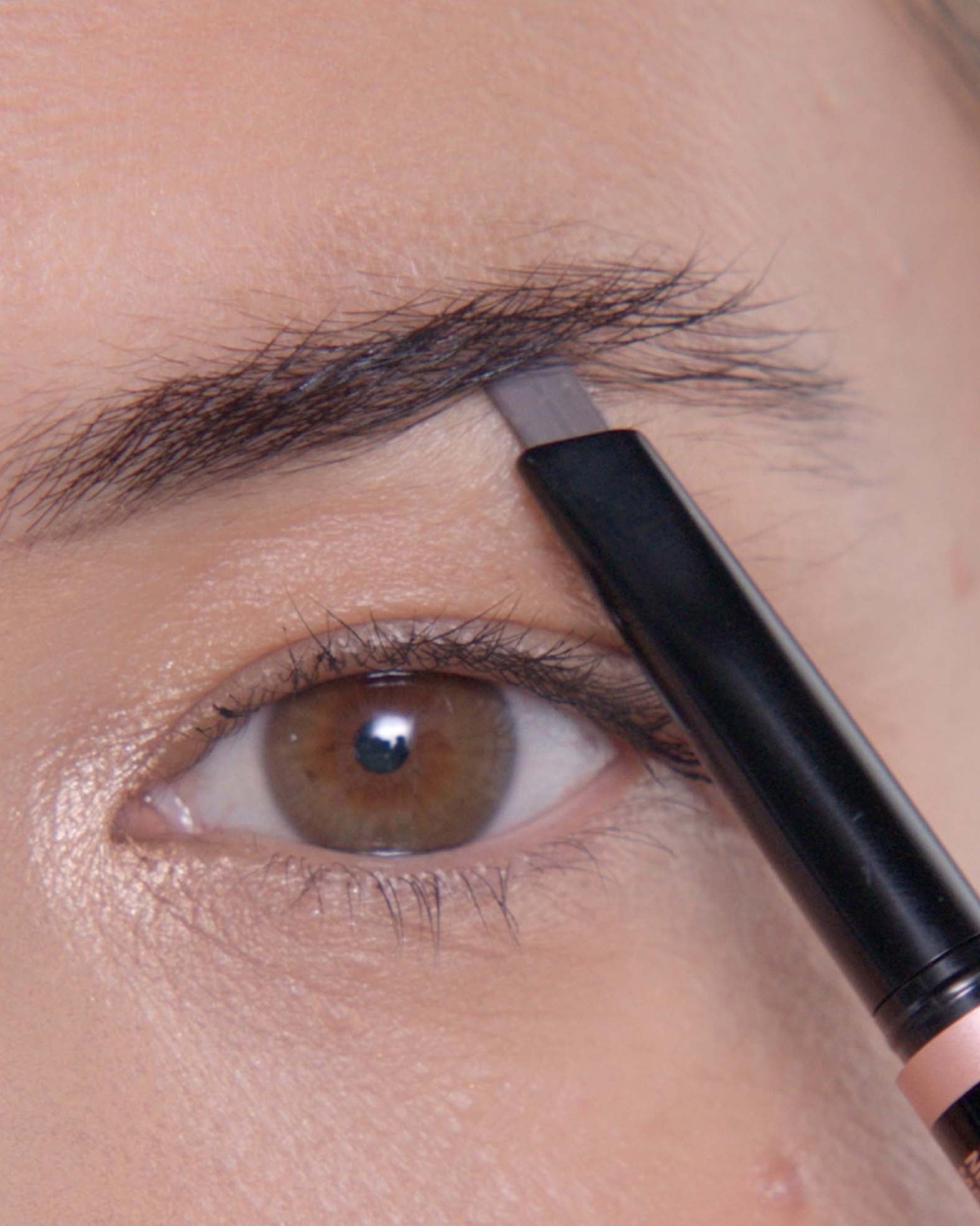 Applying Brow Definer in Medium Brown