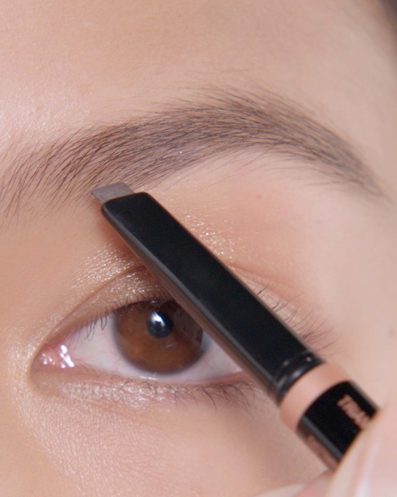 Applying Brow Definer in Medium Brown