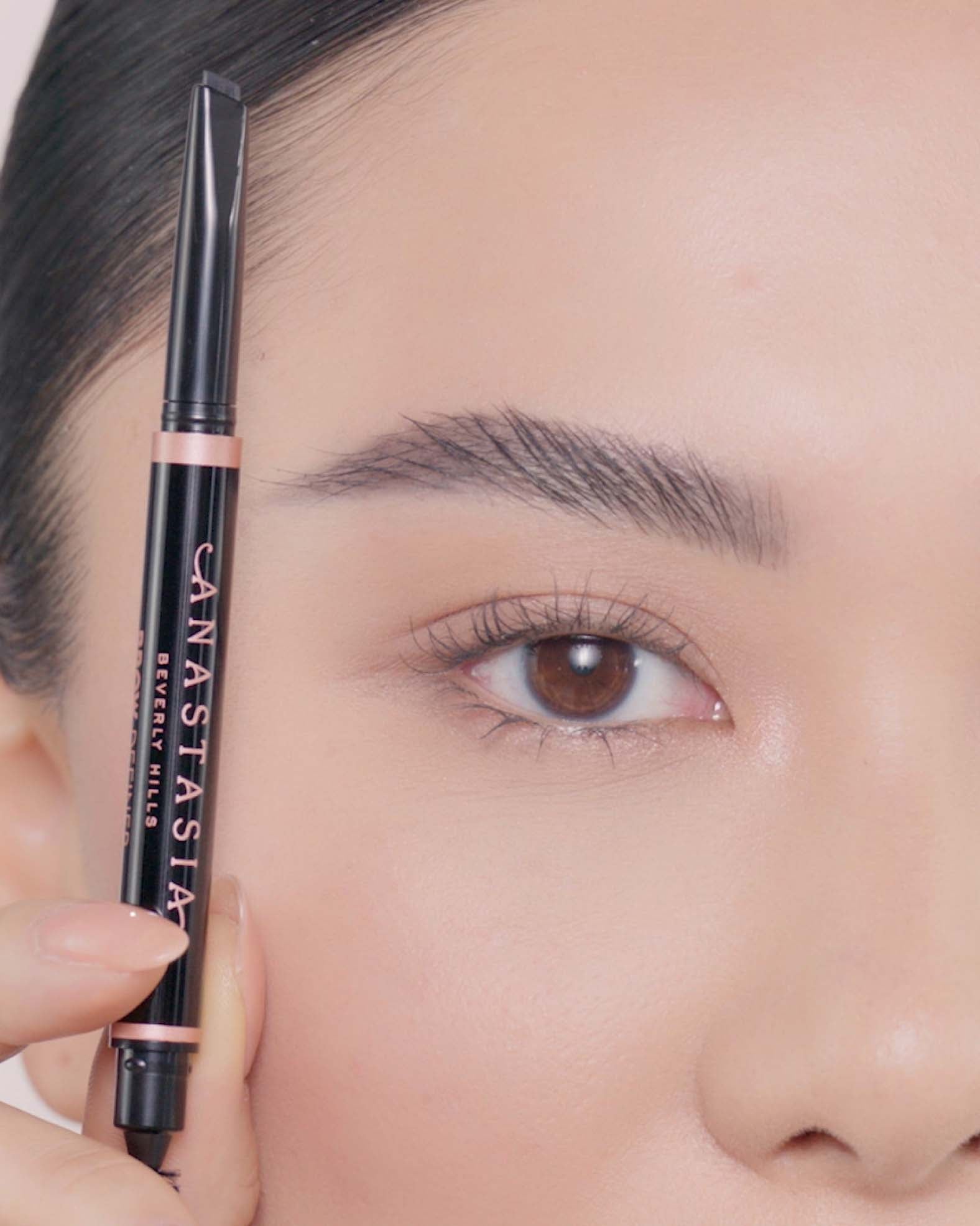 Applying Brow Definer in Granite and Brow Freeze® Gel