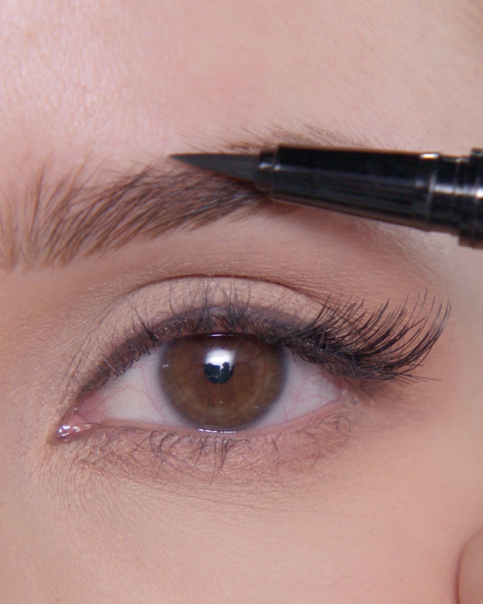 Applying Brow Pen in Soft Brown