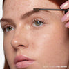 Soft Brown| Deluxe Mini Volumizing Tinted Brow Gel -Model Using Product Wand